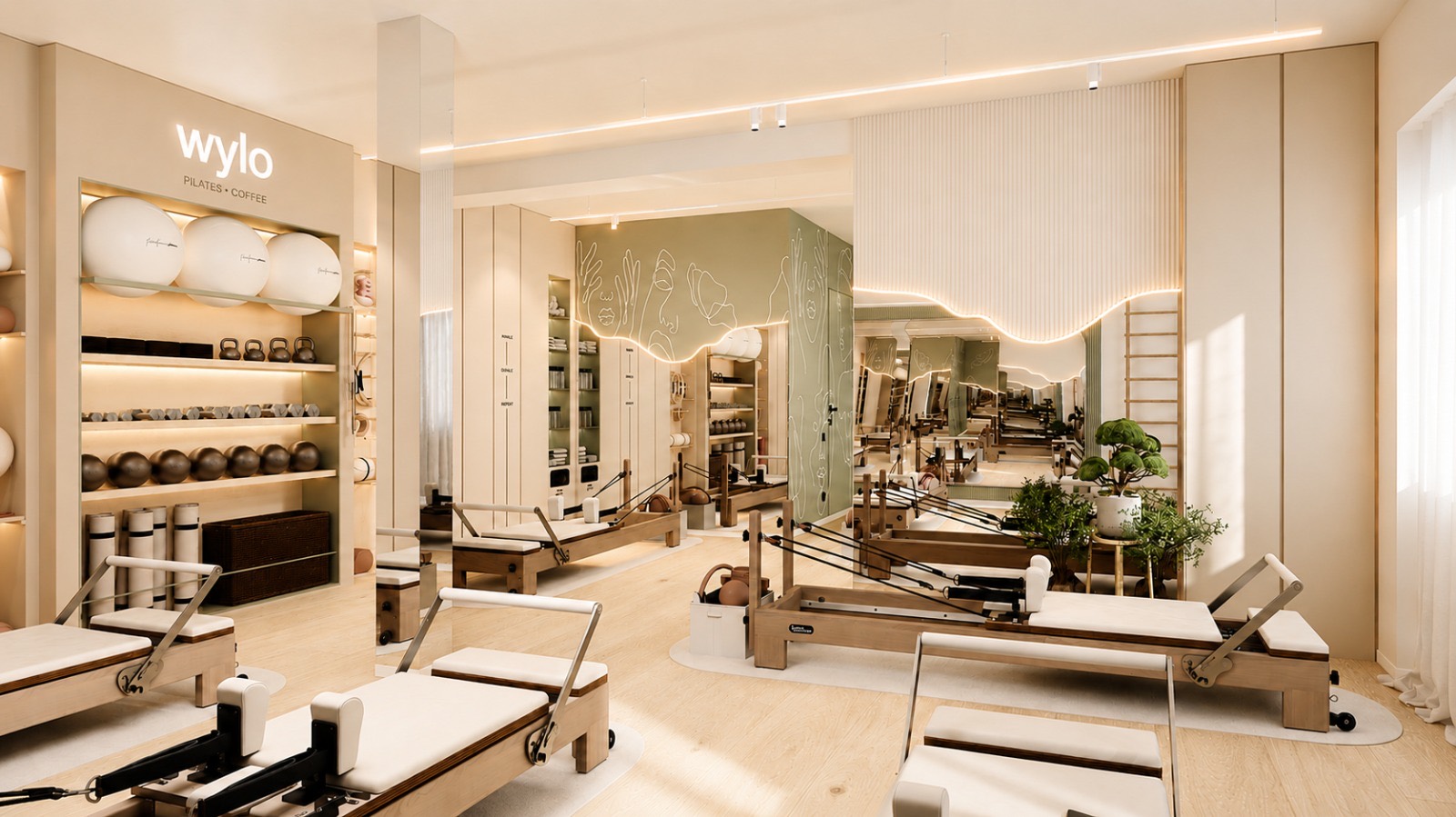 Sala Wylo cu aparate reformer, pereți crem și lumină caldă naturală
